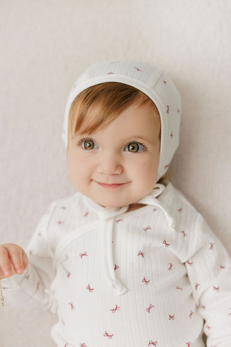 Aurora Bow Pattern Collection Footie And Bonnet - Ivory/Red