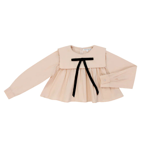 Beige blouse with a black ribbon on a white background